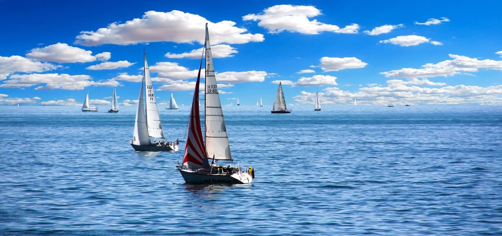 a group of sailboats in the water