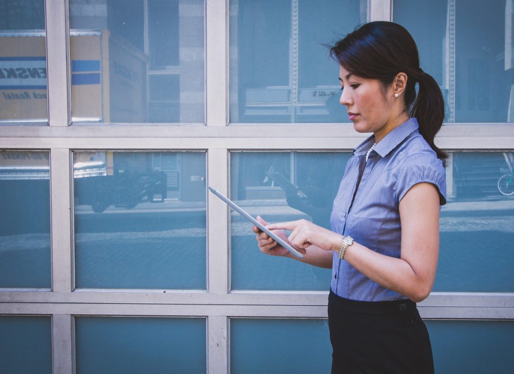 a person holding a tablet