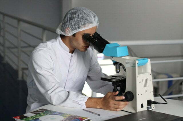 a man wearing a white lab coat