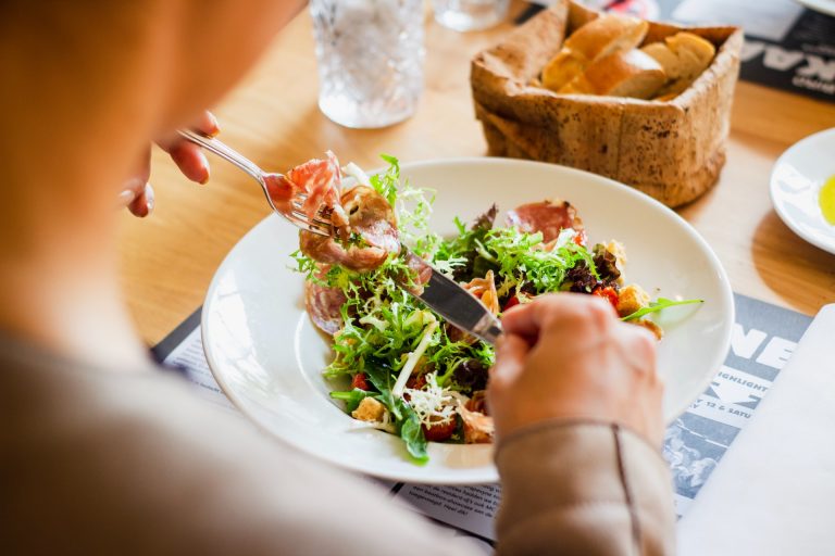 a person eating a plate of food