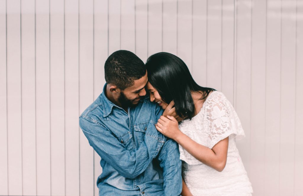 a man and woman kissing