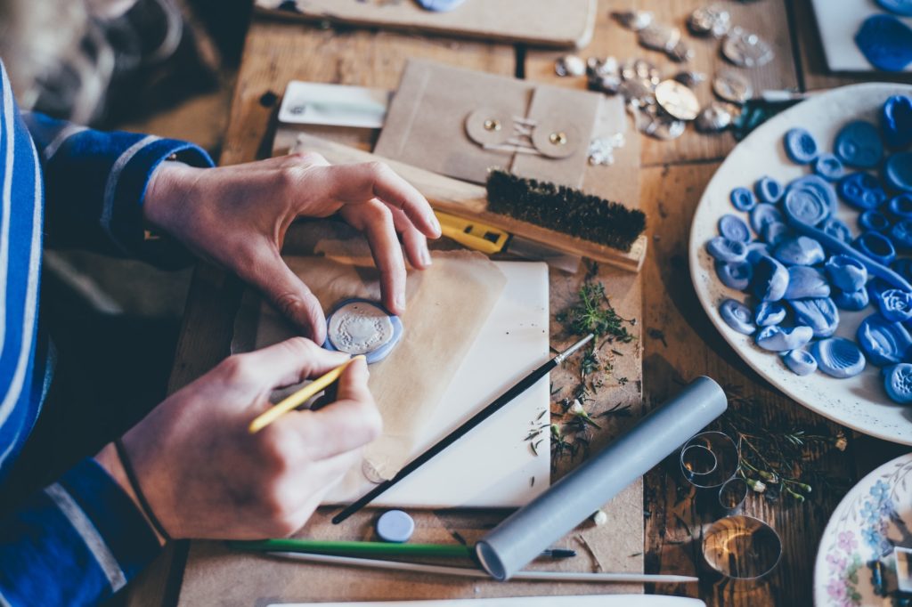 a person cutting a piece of wood