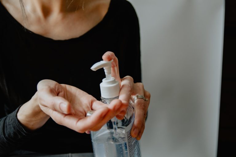 a person holding a bottle