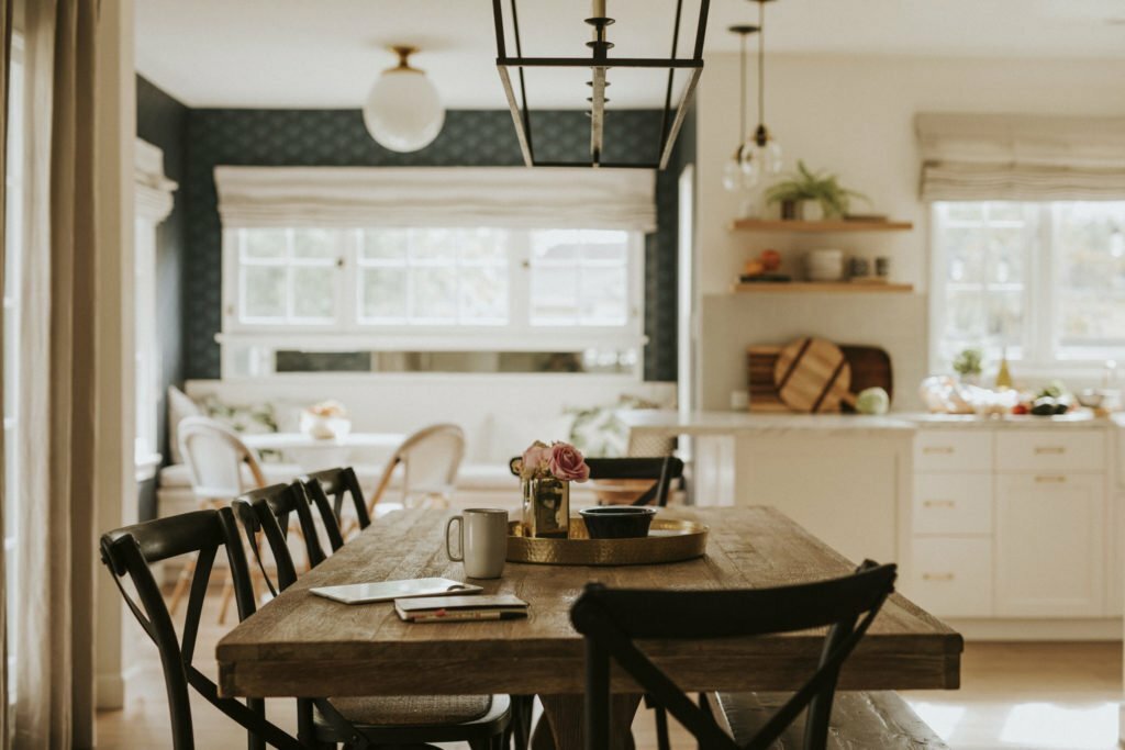 a kitchen with a table and chairs