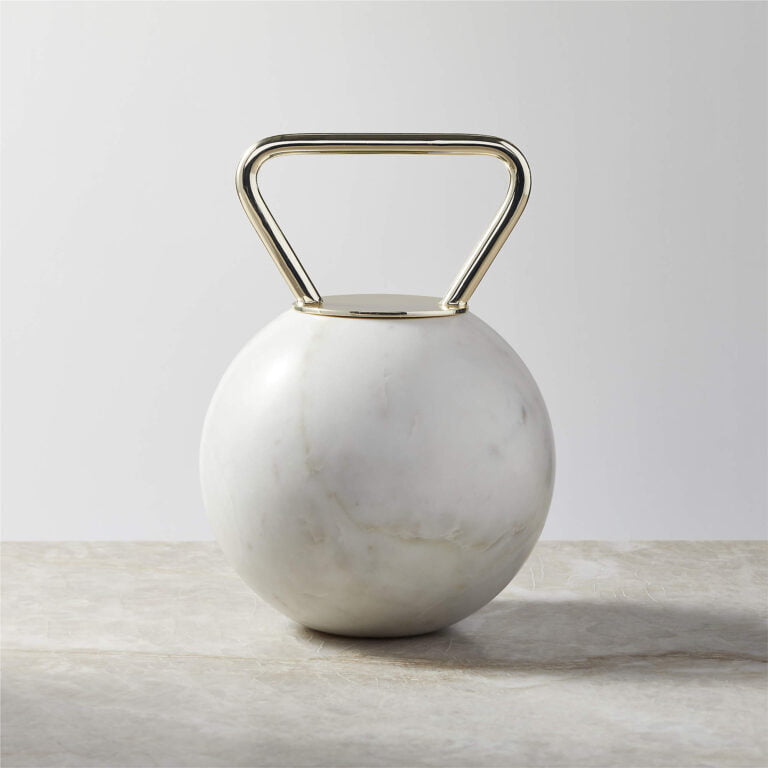a white vase with a handle